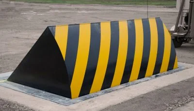 Hydraulic road blocker with black and yellow safety markings for secure vehicle access control in Pakistan
